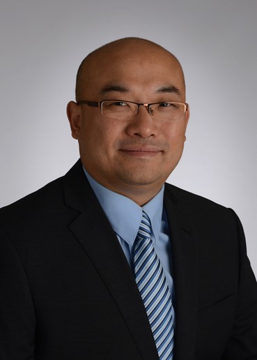 Zhiguo Zhou